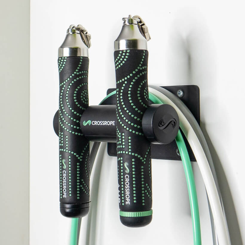 AMP Wall Mount Jump rope wall mount secured to the wall holding the AMP Set from Crossrope.