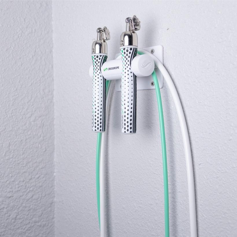 Get Lean Wall Mount Jump rope wall mount secured to the wall holding the Get Lean Set from Crossrope.
