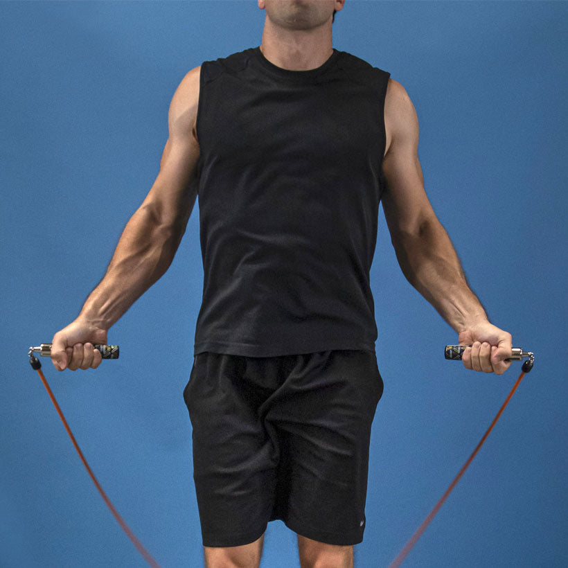 Indoor Heavy Performance Set Man jumping with a 1 LB Speed Pro rope with Speed Pro LE handles