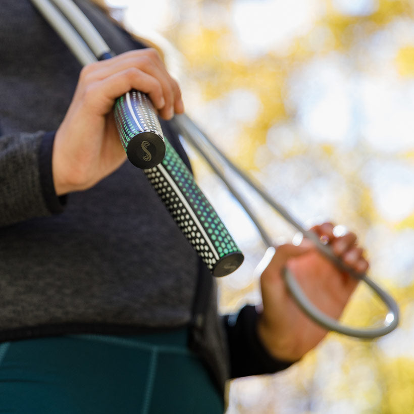 Power Handles (2022) Woman holding 1 LB heavy rope and Power Handles outside
