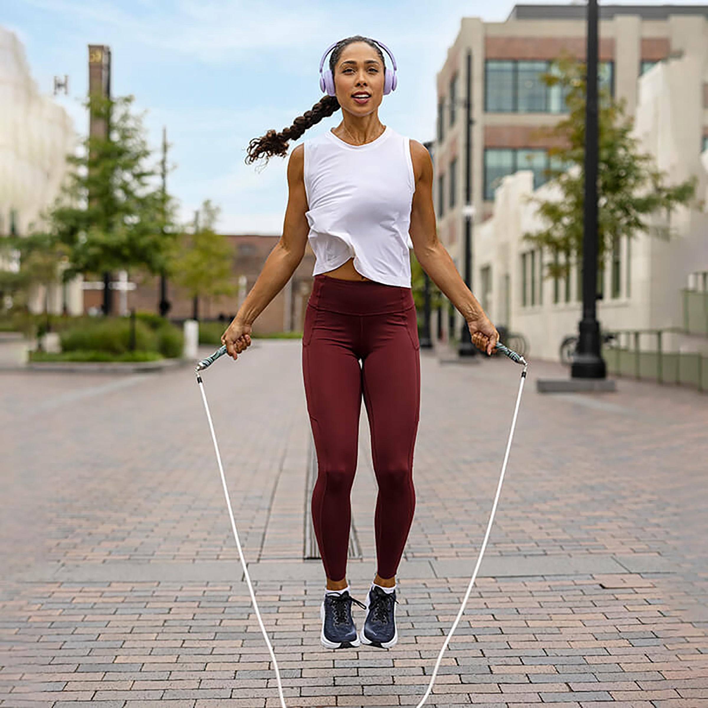 Get Lean Set Woman jumping with Crossrope jump ropes outdoors