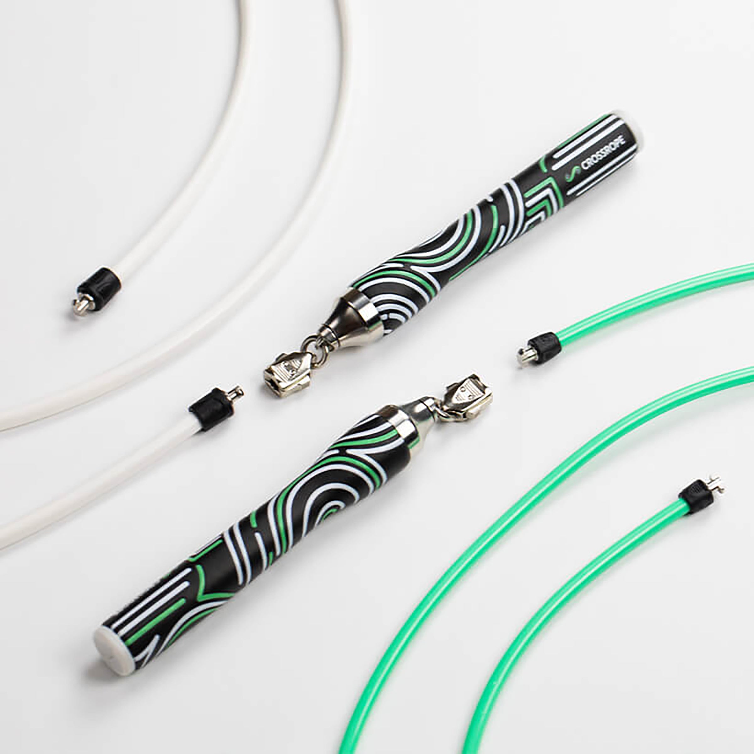 Get Lean Set Product photo of Crossrope Slim Handles with a 1/4 LB and 1/2 LB jump rope on a light background