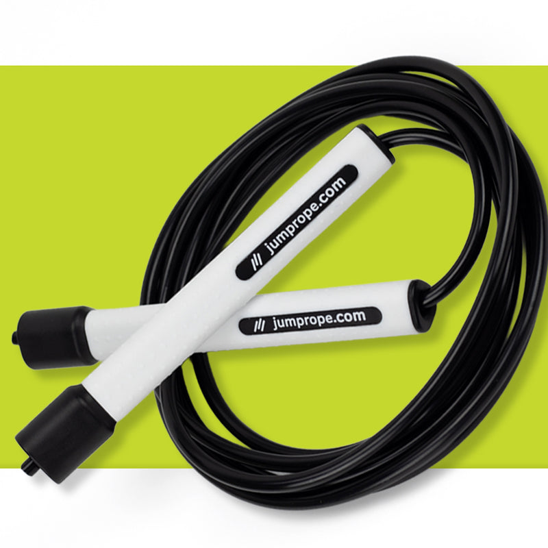Black and white jump rope on a green background