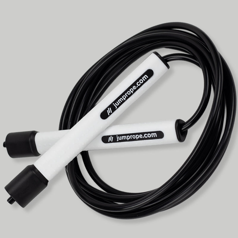 Black and white jump rope on a gray background