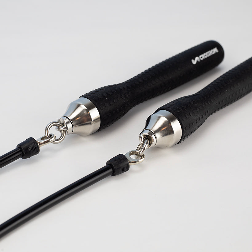 Ropeless One Pair of black jump rope handles with silver connections on a white background