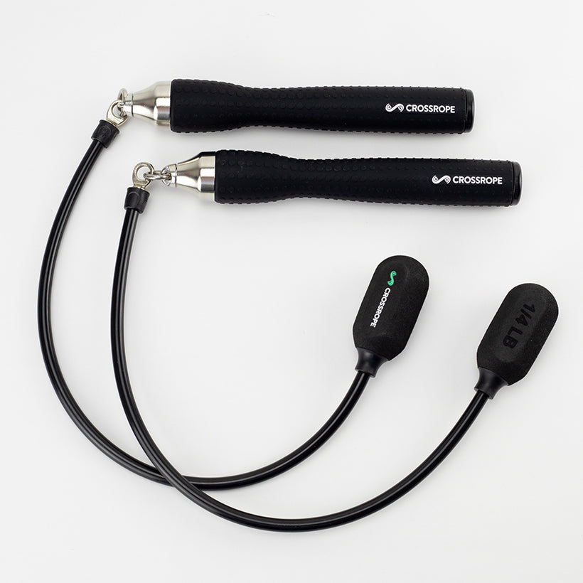 Ropeless One Black (ropeless) jump ropes with Crossrope branded handles on a white background