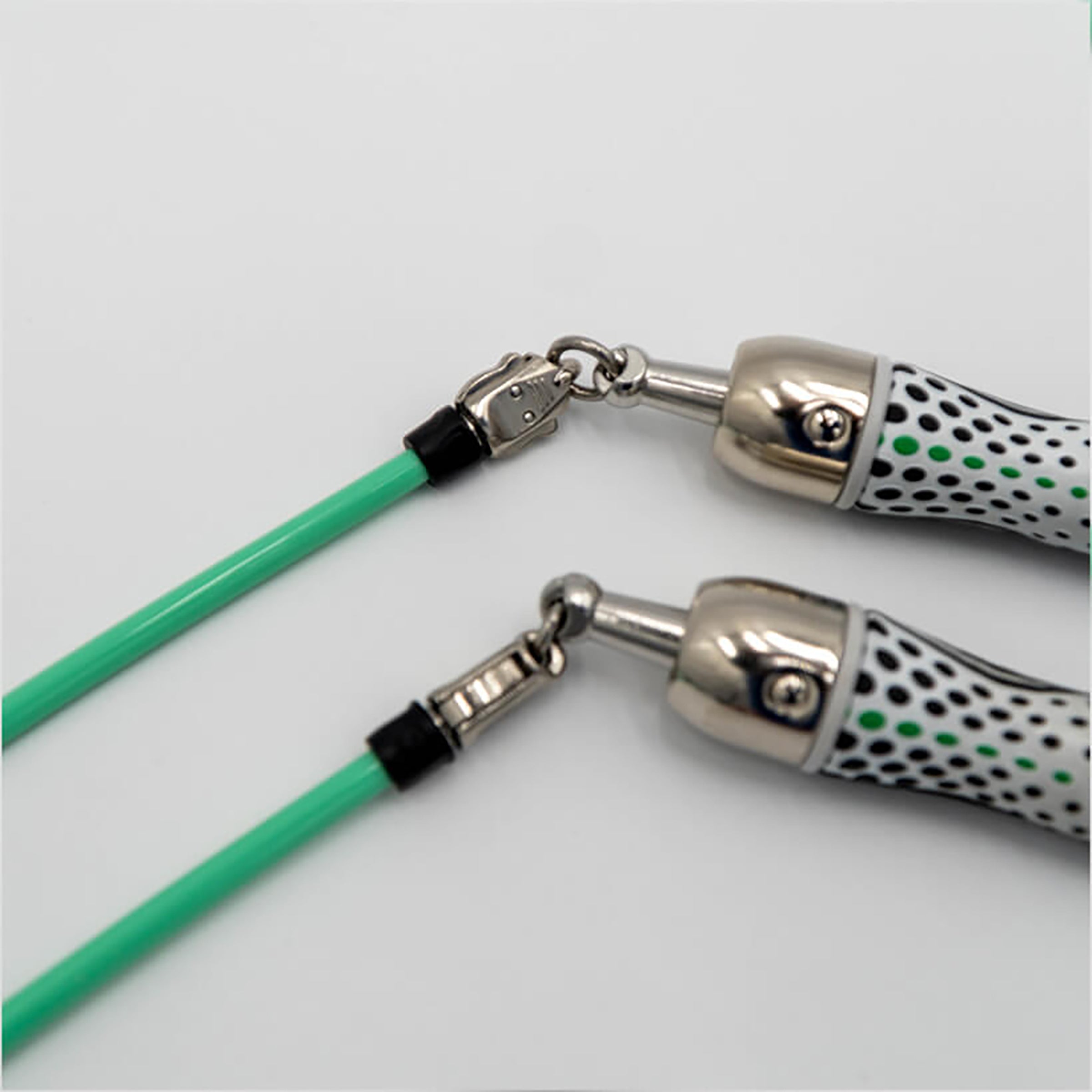 1/4 LB Ropeless Attachment 1/4 LB Ropeless Attachments connected to Slim Handles on a light background