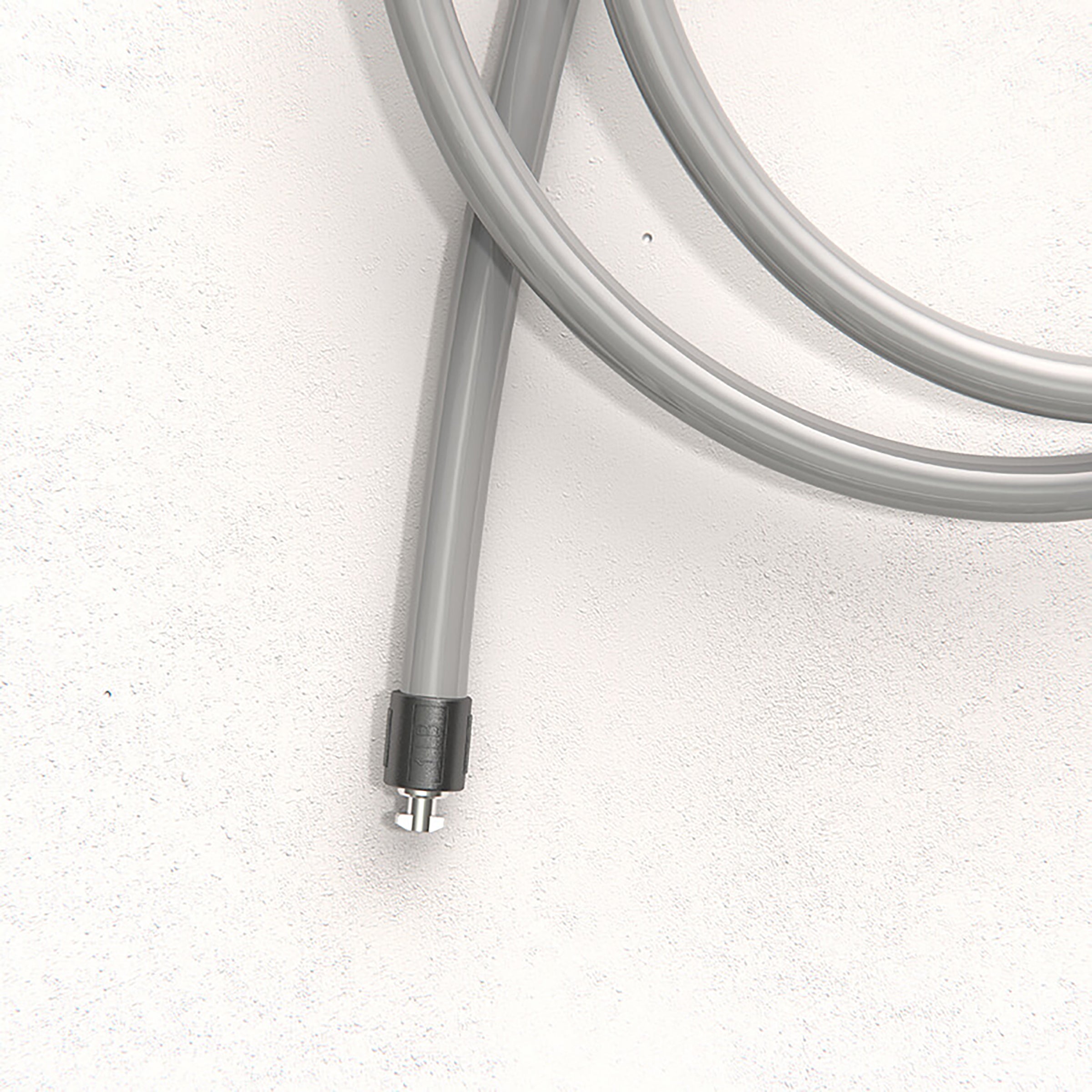 1 LB Heavy Rope Coiled gray 1 LB jump rope with a metallic connector on a light gray background