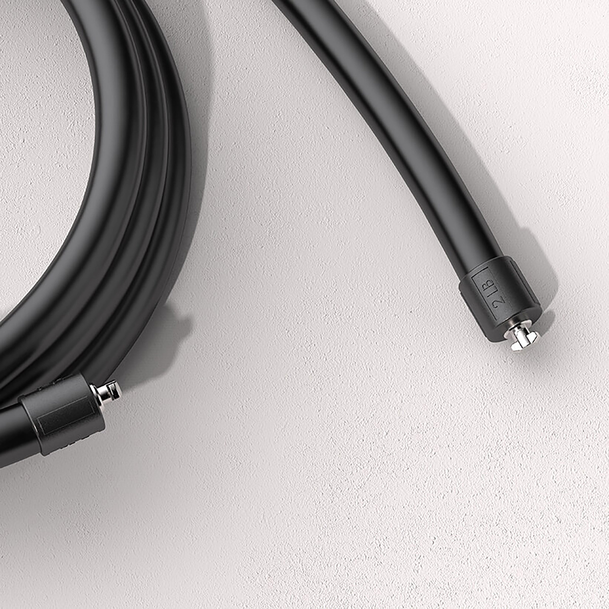 2 LB Heavy Rope Coiled 2 LB jump rope on a light background