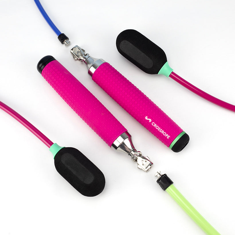 Ropeless AMP Vibe Set (LE) Pink, green and blue Ropeless jump ropes and pink jump rope handles on a white background