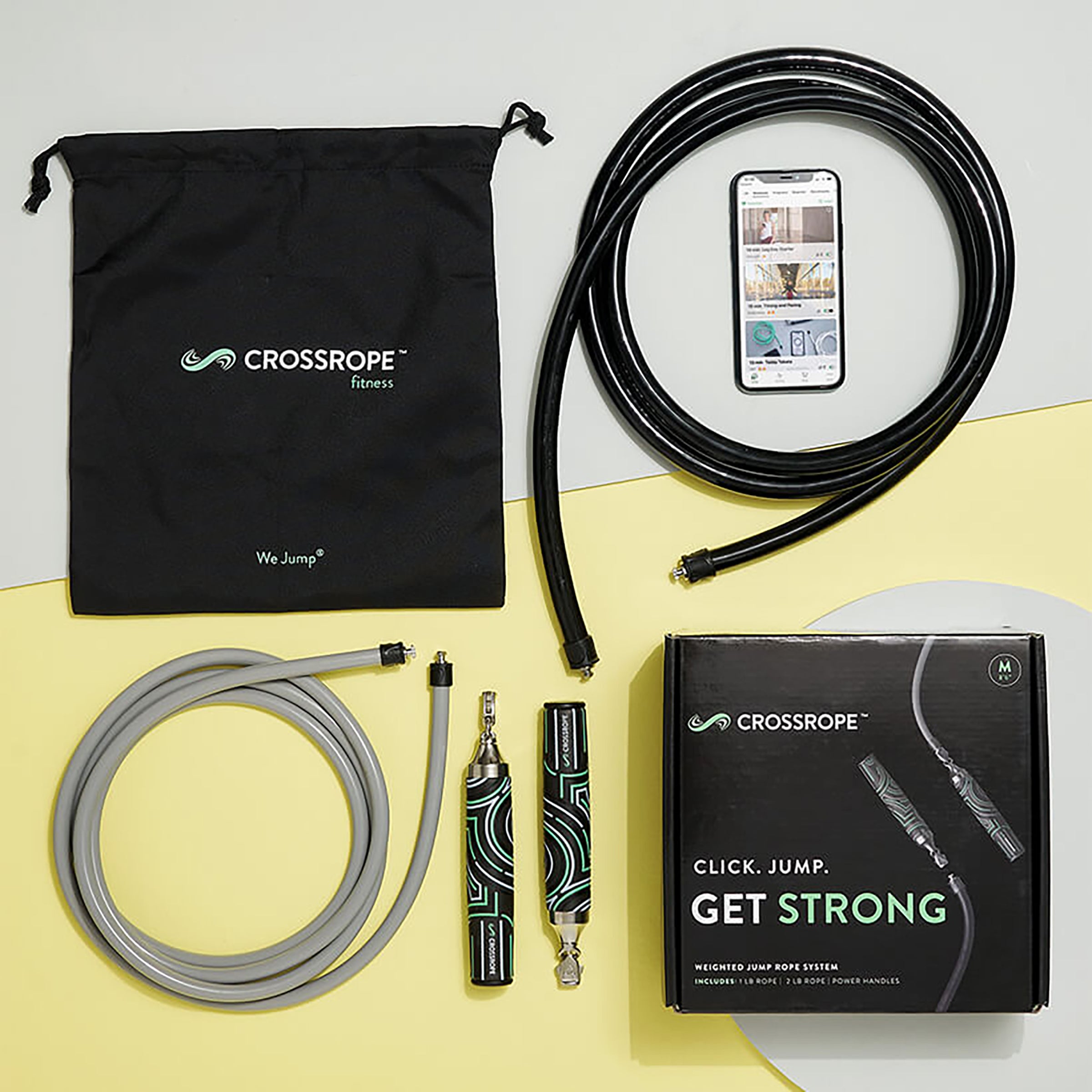 Get Strong Set An unboxed view of the Crossrope Get Strong Set with 1 LB and 2 LB jump ropes and Power Handles on a yellow and gray background