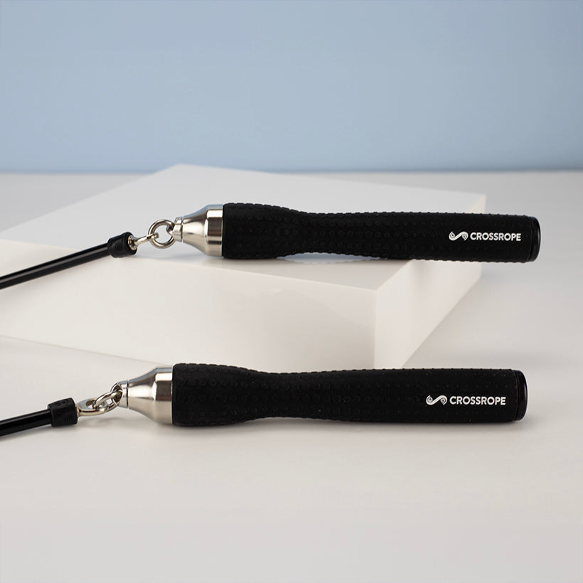 Ropeless One Black jump rope with silver clasp on a light gray background