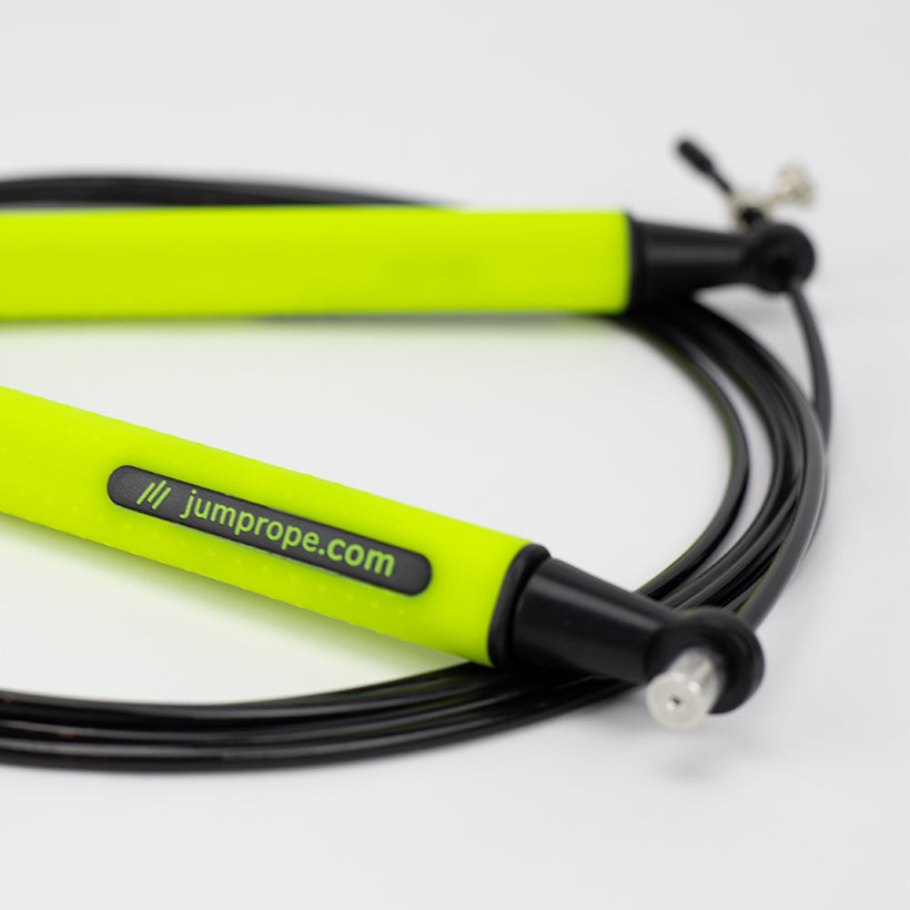 Speed Rope Speed Rope product photo on white and background zoomed in on the handle with jumprope.com logo in focus