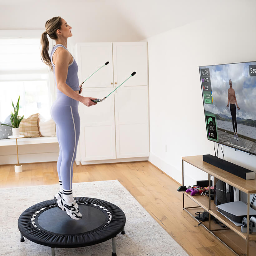Ropeless Rebounder AMP Set Female working out with a rebounder and Crossrope Ropeless