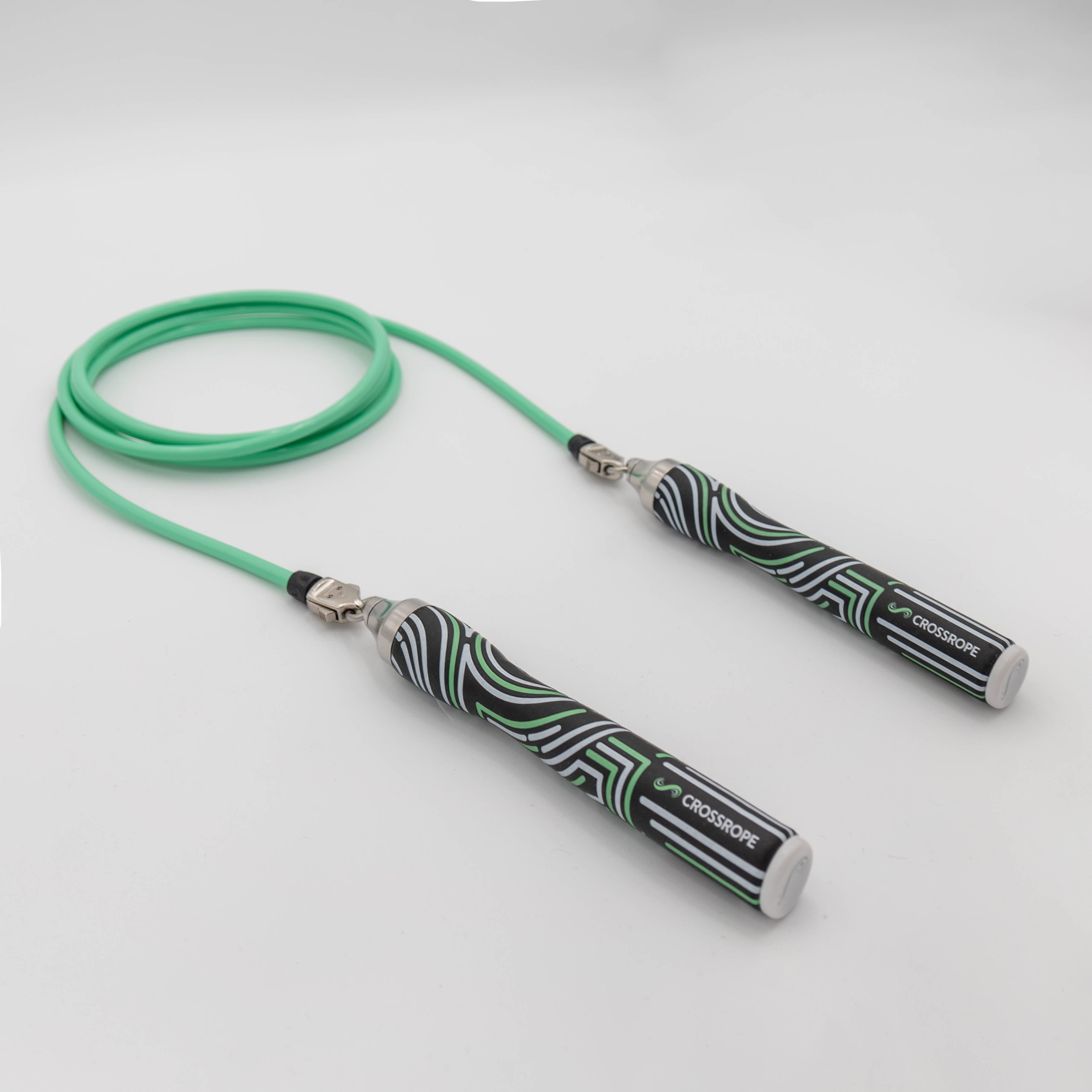 Starter Jump Rope Set A coiled view of the 1/4 LB rope with the 2023 Slim Handles