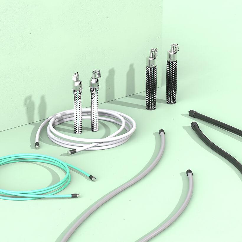 AMP Set [Test draft] Slim Handles and Power Handles standing vertically on the floor with a 1/4 LB, 1/2 LB, 1 LB and 2 LB jump rope around them